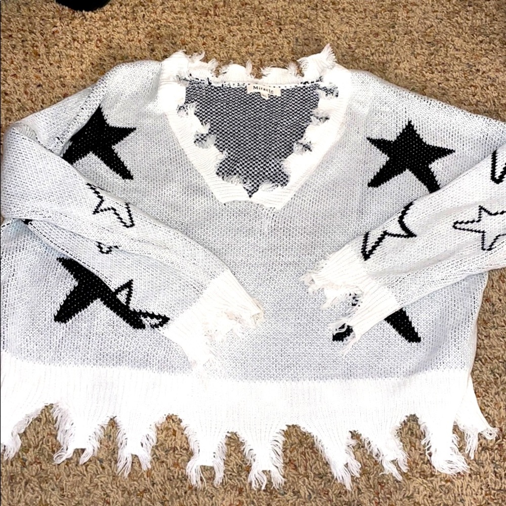 Distressed star sweater